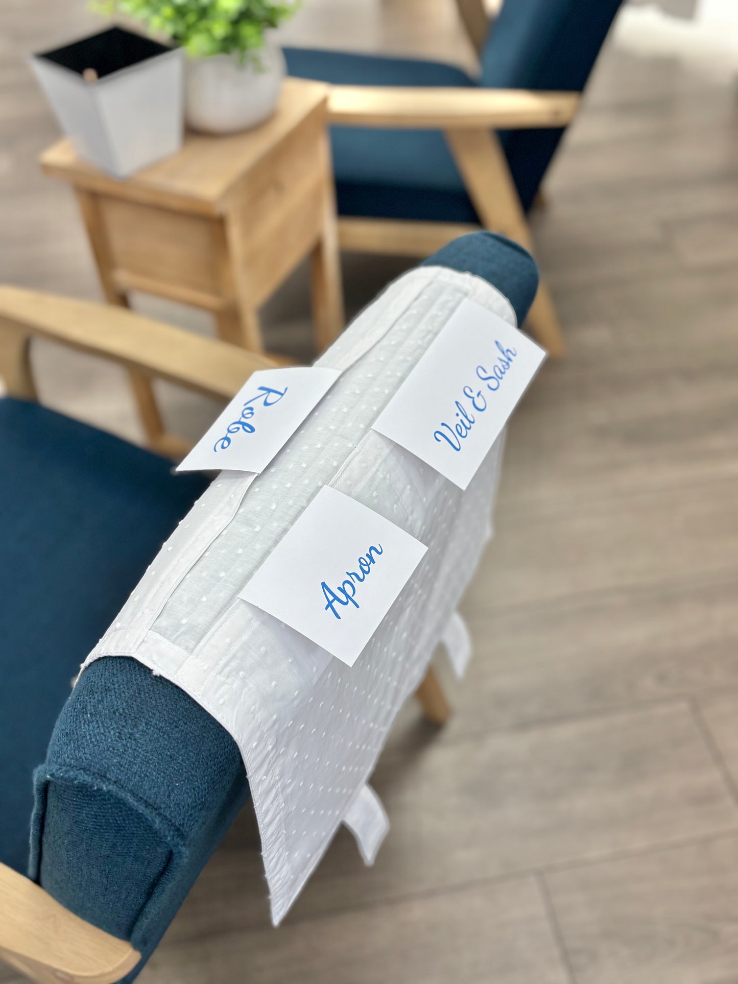 Cotton envelope draped over chair with labels.