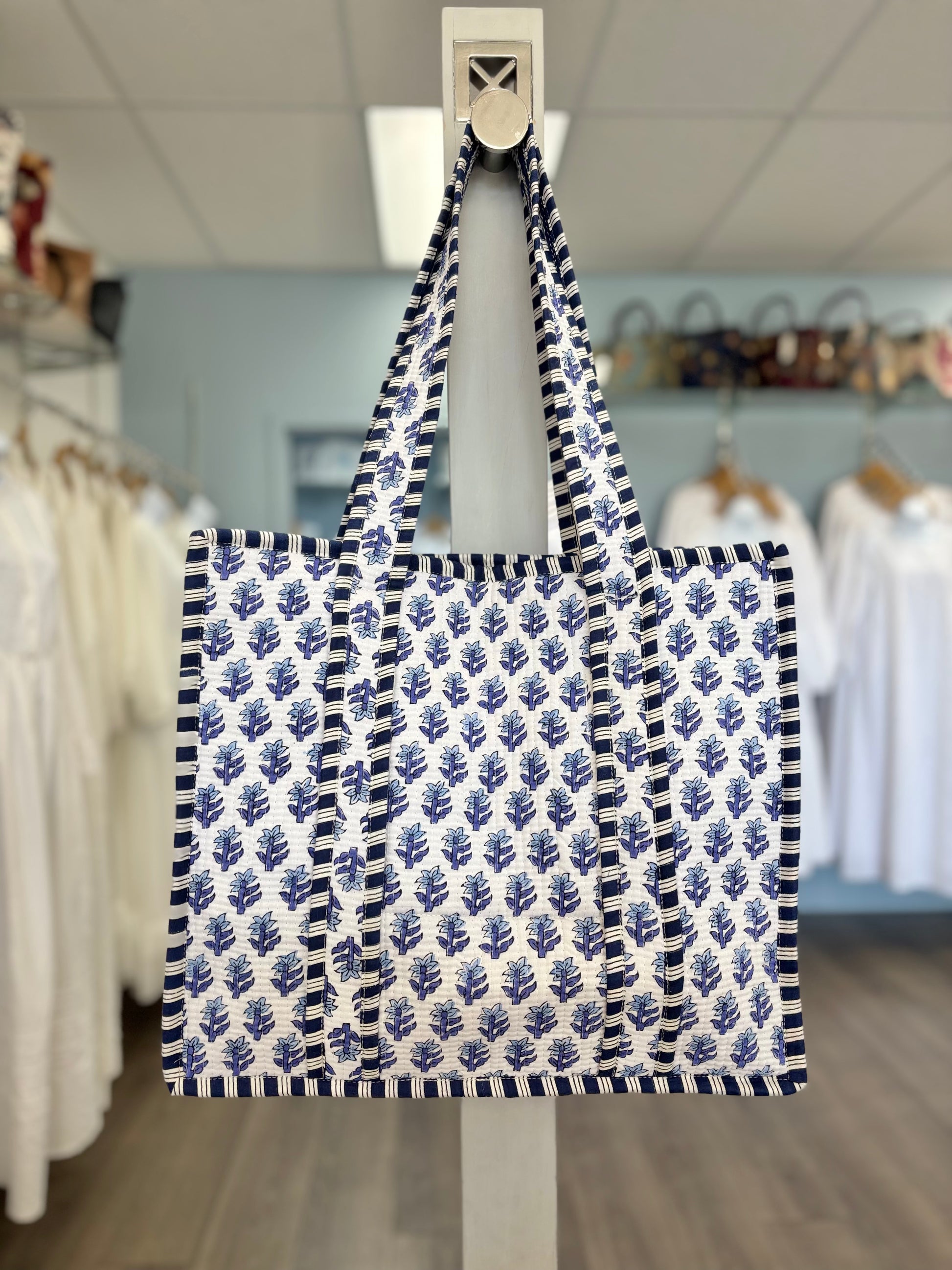 blue floral quilted bag hanging