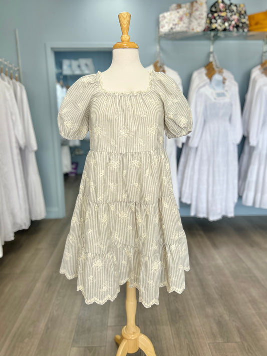 Short striped dress with floral embroidery.