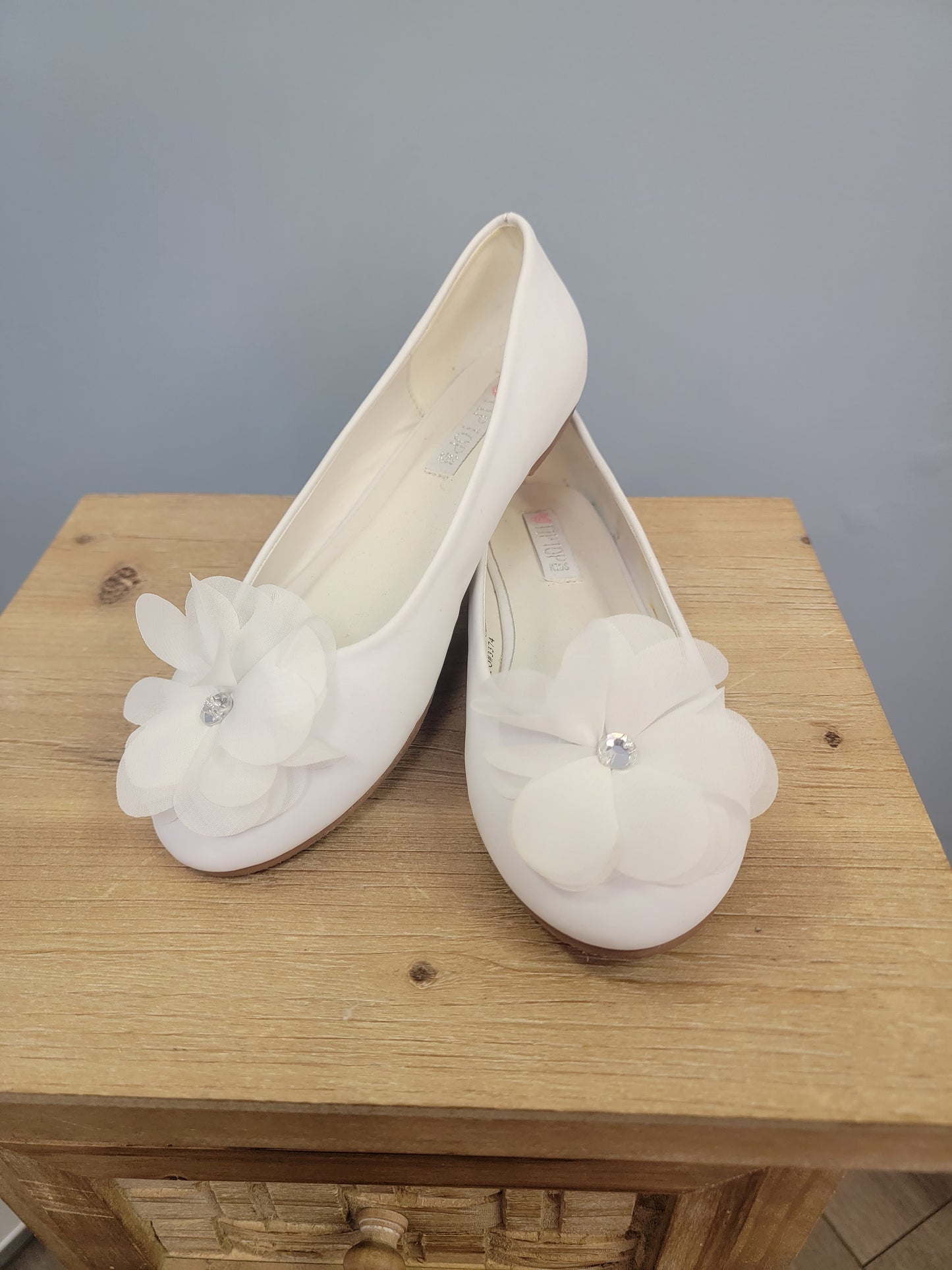 white girl's flats with flower on toe