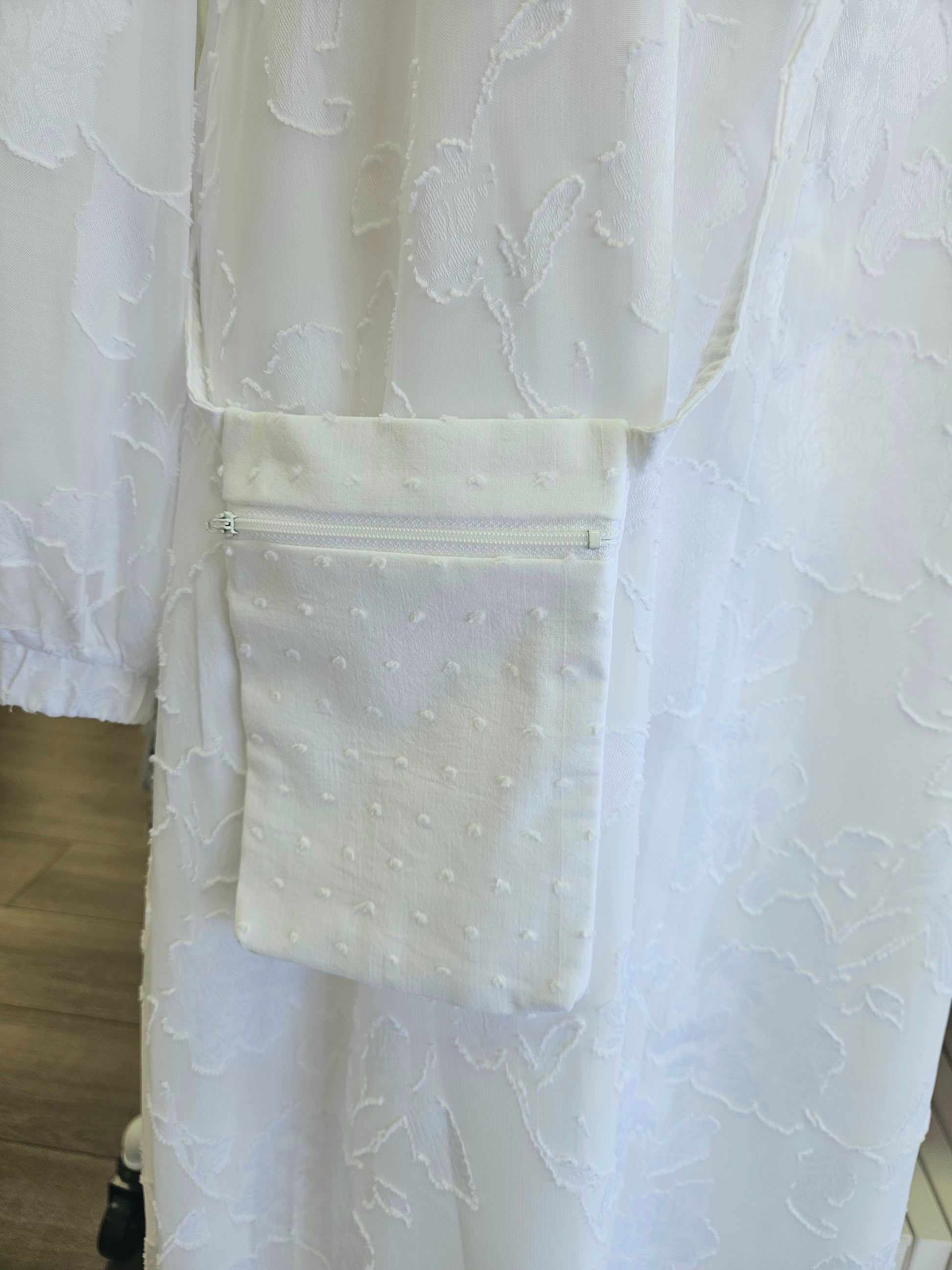 white cross body cell phone bag