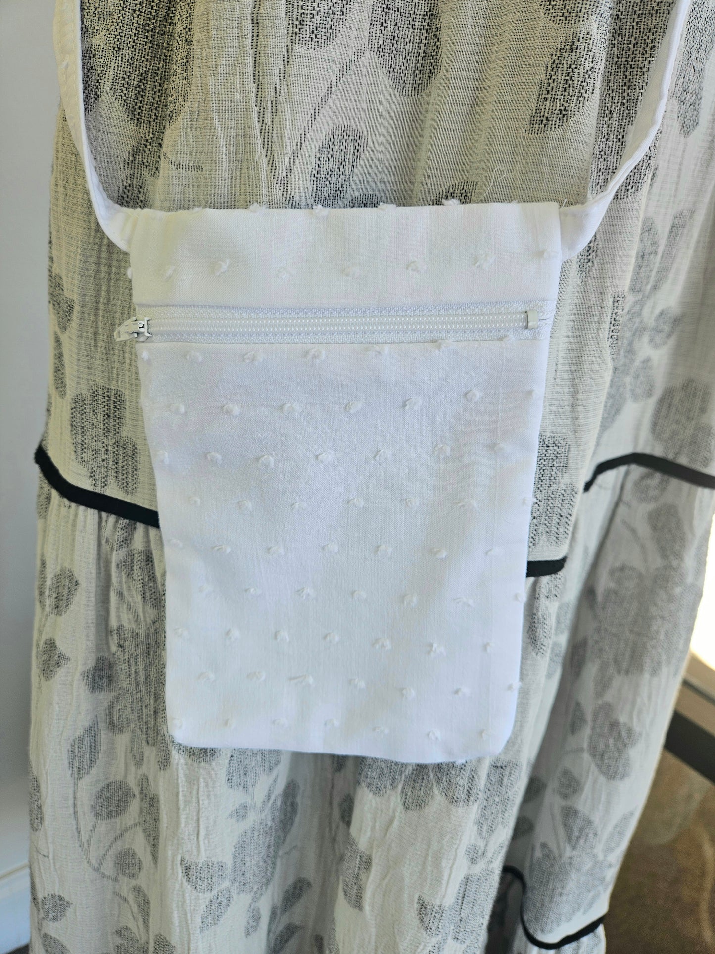 white cross body cell phone bag