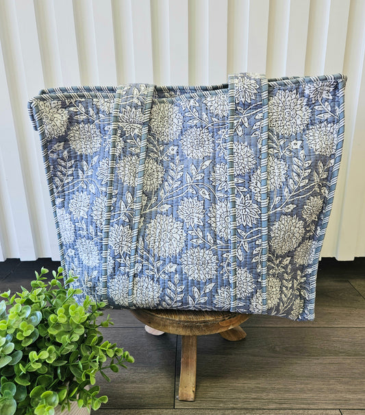 blue floral quilted bag on stool