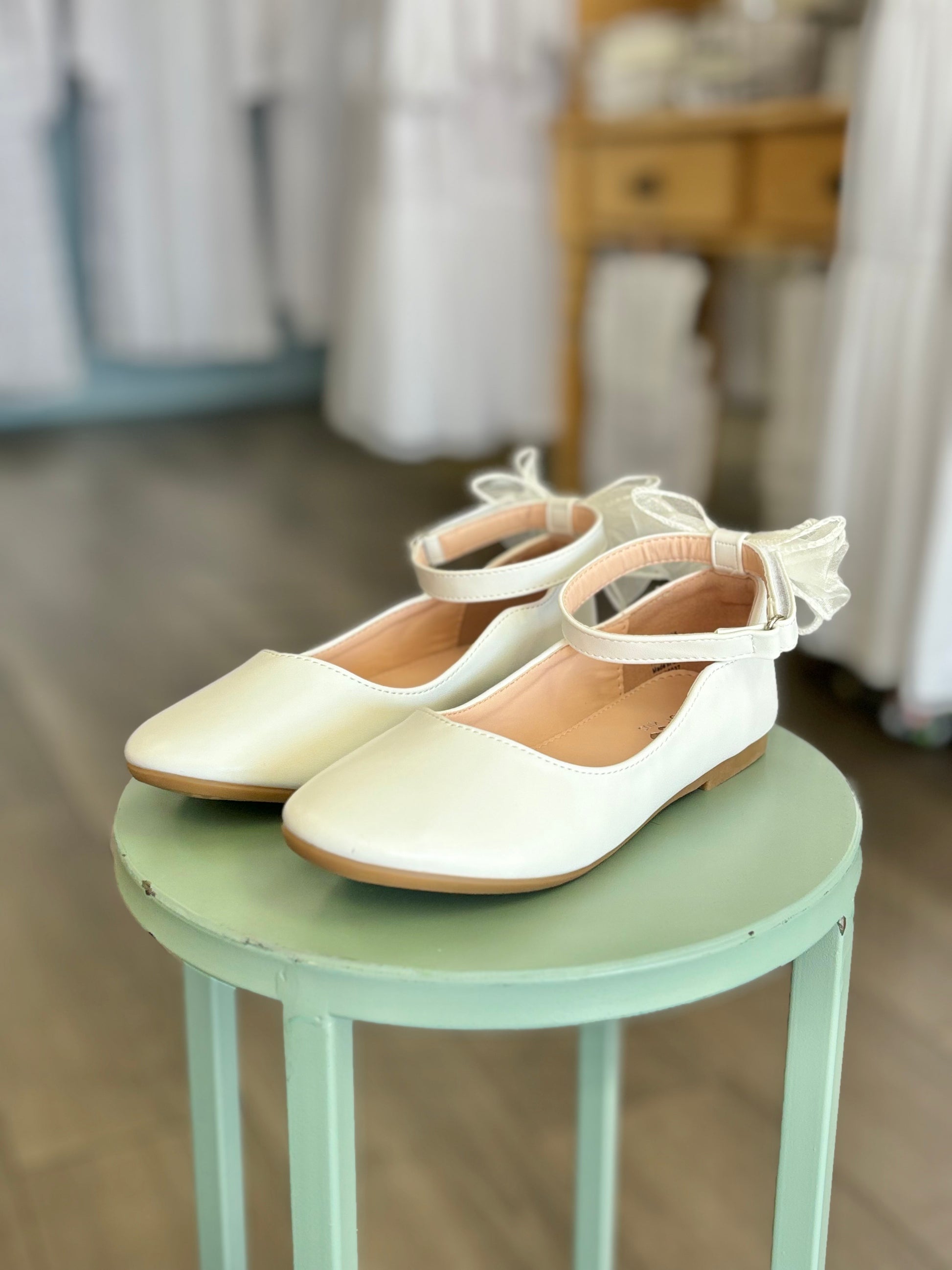 girl's flats with strap and bow in back