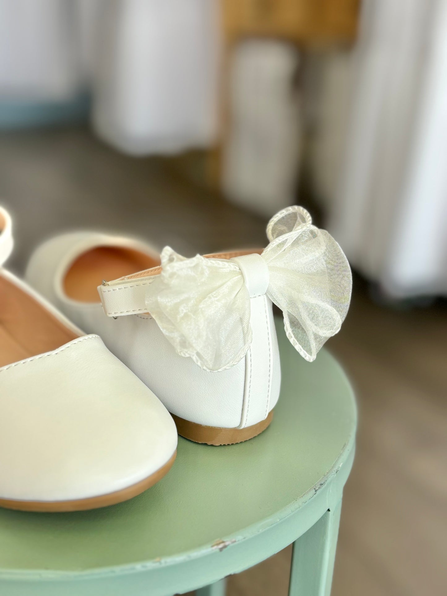 girl's flats with strap and bow in back