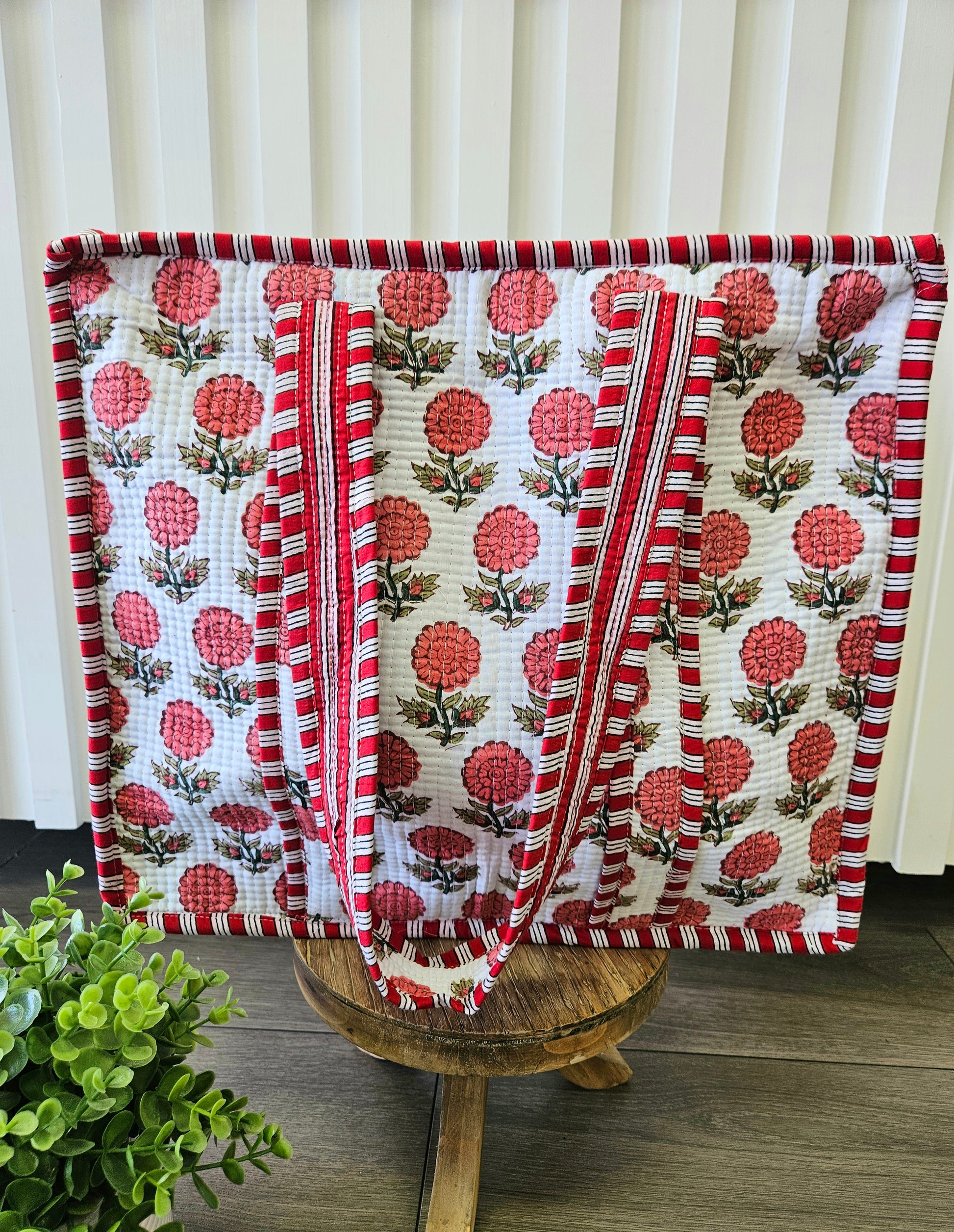 red floral quilted bag