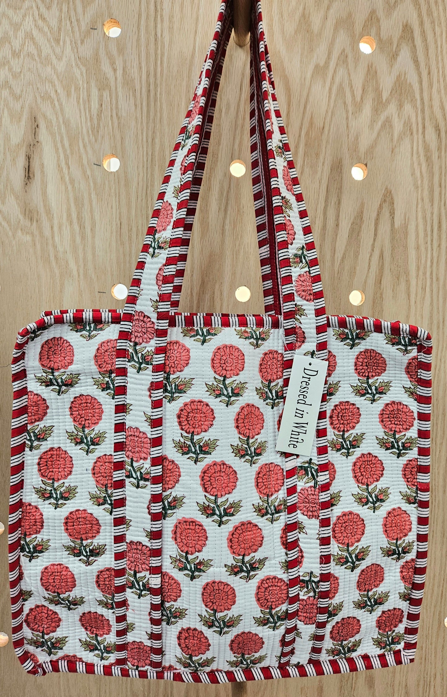 red floral quilted bag