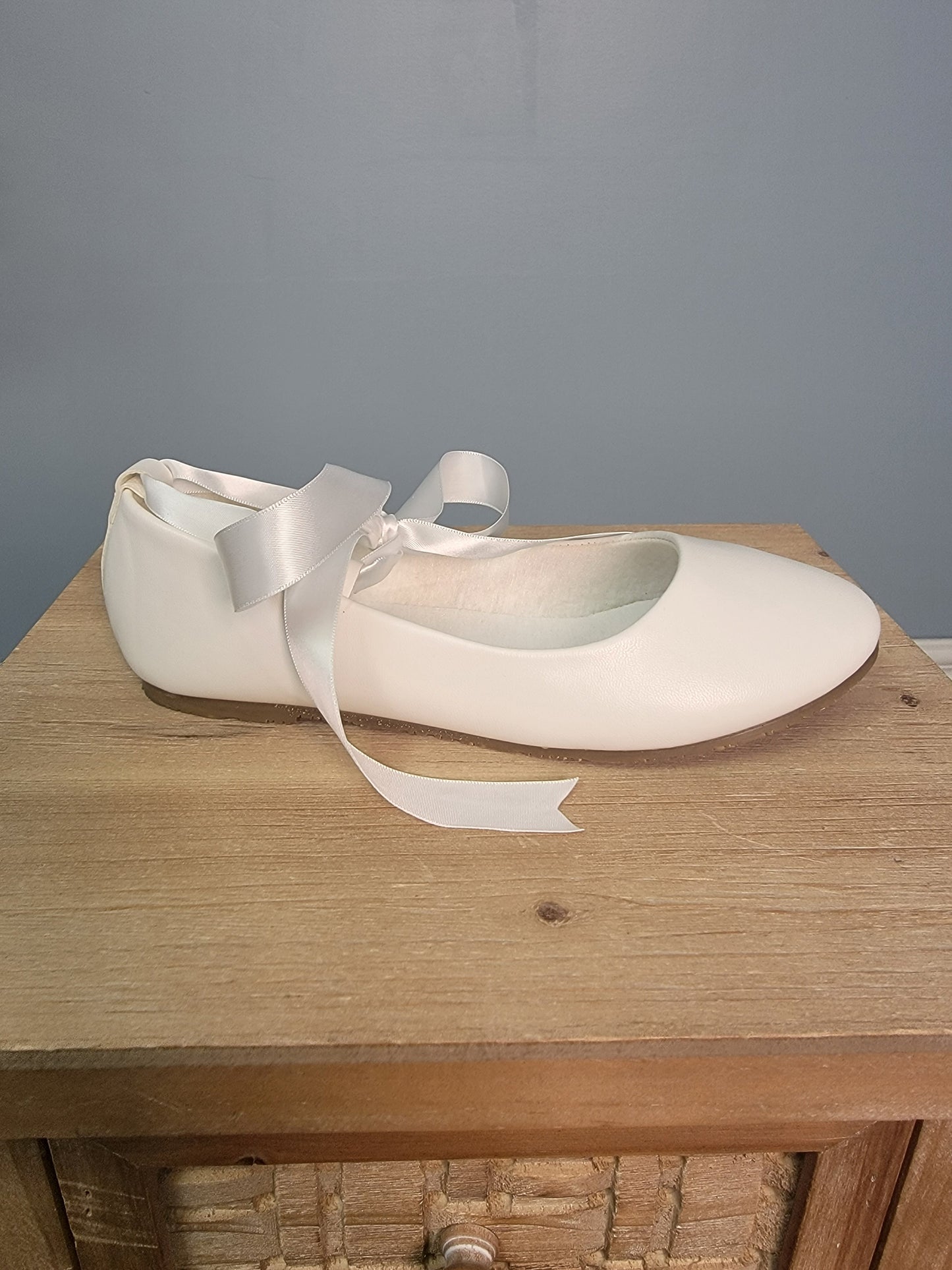 white ballerina flats with ribbon tie