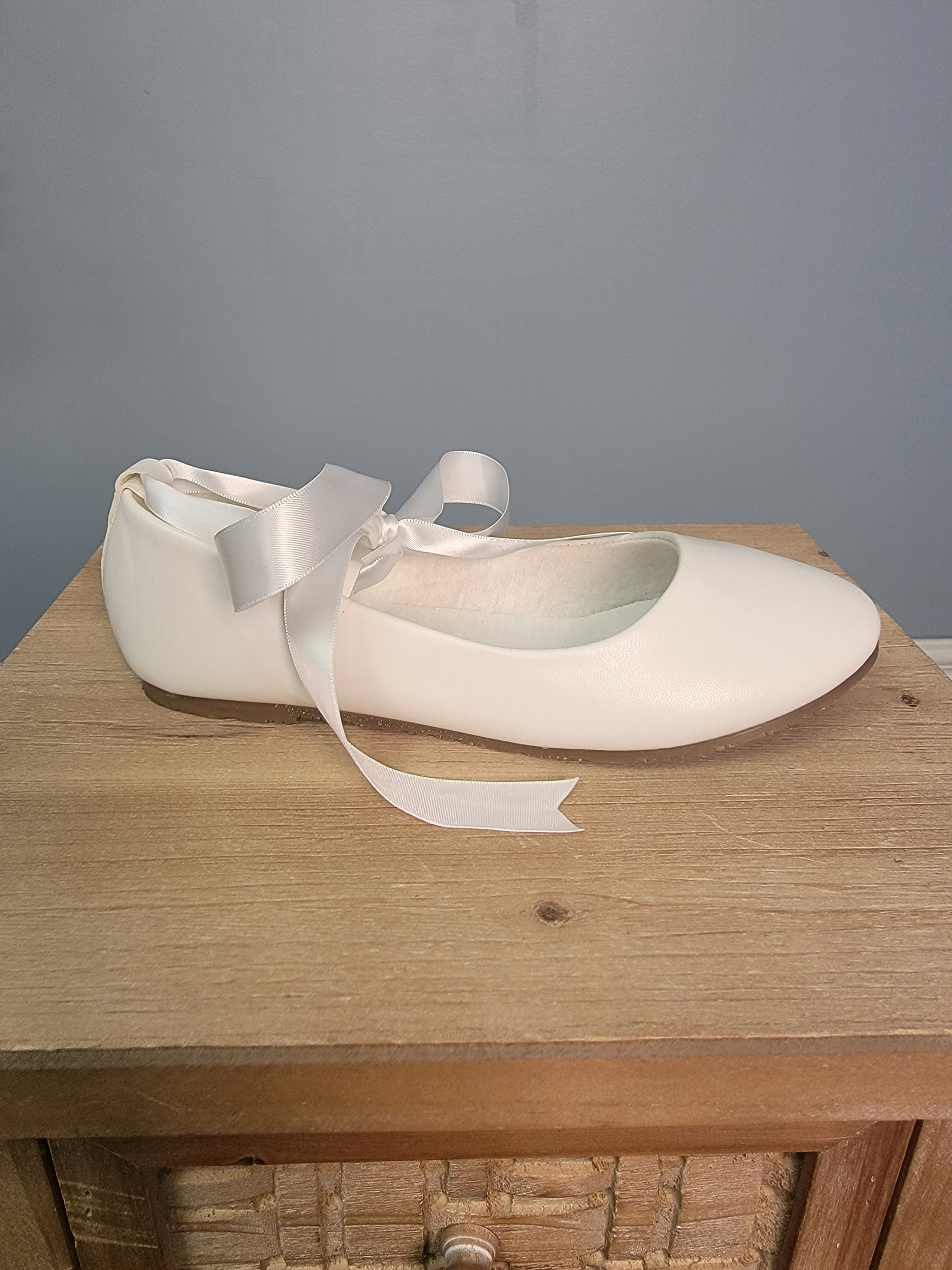 white ballerina flats with ribbon tie
